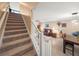 Stairwell leading to an open concept living room and dining room at 17308 Holly Well Ave, Wimauma, FL 33598