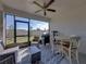This patio is screened and features seating, a table with chairs, and a grill at 17308 Holly Well Ave, Wimauma, FL 33598