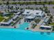 Aerial view of a lagoon-style pool area, with a bar and plenty of seating at 17308 Holly Well Ave, Wimauma, FL 33598