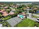 Community aerial showcasing tennis courts, pool, and lush landscaping at 1003 Hammock Pine Blvd # 1003, Clearwater, FL 33761