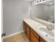 Bathroom featuring a single sink vanity with wood cabinets and neutral countertop at 1003 Hammock Pine Blvd # 1003, Clearwater, FL 33761