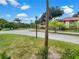 Neighborhood street featuring well-maintained landscaping and beautiful homes at 1003 Hammock Pine Blvd # 1003, Clearwater, FL 33761