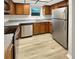 Modern kitchen features stainless steel appliances, durable counters, and ample cabinetry at 1003 Hammock Pine Blvd # 1003, Clearwater, FL 33761