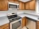 This kitchen features stainless appliances and ample counter space at 1003 Hammock Pine Blvd # 1003, Clearwater, FL 33761