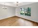 An open living room with beautiful floors and bright windows at 1003 Hammock Pine Blvd # 1003, Clearwater, FL 33761