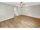Bright living room features new flooring and neutral paint, leading to other rooms at 1003 Hammock Pine Blvd # 1003, Clearwater, FL 33761