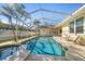 Inviting screened pool and spa area features ample space for outdoor entertaining and relaxing at 109 Live Oak Ln, Largo, FL 33770