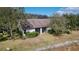 Exterior view of the back of the property with a screened-in lanai at 11212 Port Douglas Dr, New Port Richey, FL 34654