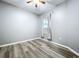 Bedroom with hardwood floors and a ceiling fan at 11212 Port Douglas Dr, New Port Richey, FL 34654