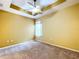 Bright bedroom with a modern ceiling fan, neutral carpeting, and a window providing natural light at 11212 Port Douglas Dr, New Port Richey, FL 34654