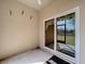 A covered outdoor lanai featuring a sliding glass door to the backyard and patio at 11212 Port Douglas Dr, New Port Richey, FL 34654
