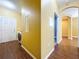 A bright laundry room featuring a washer and dryer, white walls, and tile flooring at 11212 Port Douglas Dr, New Port Richey, FL 34654