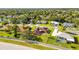 Birds eye view of a home with a spacious yard, custom patio, and inground pool nearby at 13481 Pullman Dr, Spring Hill, FL 34609