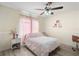 Cozy bedroom with neutral colors, a ceiling fan, and a nice workspace at 13481 Pullman Dr, Spring Hill, FL 34609