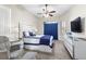 Well-lit bedroom with neutral colors, a ceiling fan, and a bright window at 13481 Pullman Dr, Spring Hill, FL 34609