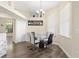 Dining area with modern table and chairs, wood floors and lots of natural light at 13481 Pullman Dr, Spring Hill, FL 34609