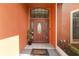 Inviting front entrance featuring a decorative door with a 'welcome' mat and small topiaries at 13481 Pullman Dr, Spring Hill, FL 34609