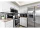 Well-equipped kitchen with stainless steel appliances and stylish backsplash at 13481 Pullman Dr, Spring Hill, FL 34609