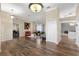 Bright living room featuring hardwood floors, a decorative light fixture, and stylish decor at 13481 Pullman Dr, Spring Hill, FL 34609