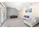 Spacious living room with tile floors, neutral walls and white sofa at 13481 Pullman Dr, Spring Hill, FL 34609