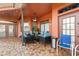 Relaxing covered patio with stylish seating and brick flooring at 13481 Pullman Dr, Spring Hill, FL 34609