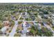 Aerial view showcasing the home's location within a serene and well-treed residential neighborhood at 1404 Wood Ave, Clearwater, FL 33755