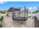 Outdoor space boasts a trampoline, a covered patio, and manicured landscaping at 1404 Wood Ave, Clearwater, FL 33755