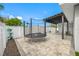 Backyard featuring a trampoline, a covered patio, and low-maintenance landscaping at 1404 Wood Ave, Clearwater, FL 33755