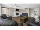 Bright living room with a fireplace, hardwood floors, and comfortable seating at 1404 Wood Ave, Clearwater, FL 33755