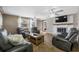 Spacious living room with fireplace, modern ceiling fans, and natural light at 1404 Wood Ave, Clearwater, FL 33755