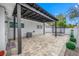Charming covered patio with pavers and ample space for outdoor entertaining and leisure activities at 1404 Wood Ave, Clearwater, FL 33755