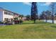 Backyard of home overlooking a body of water and lush green lawn at 1411 Water View W Dr, Largo, FL 33771