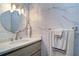 Stylish bathroom with marble tile, modern vanity, and elegant fixtures for a spa-like experience at 1411 Water View W Dr, Largo, FL 33771