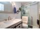 Bathroom featuring sink with stone countertops and glass shower at 1411 Water View W Dr, Largo, FL 33771