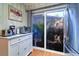 Bright breakfast nook featuring a sliding glass door providing natural light and serene outdoor views at 1411 Water View W Dr, Largo, FL 33771
