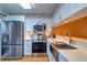 Modern kitchen featuring stainless steel appliances, white cabinets, and marble countertops for a sleek design at 1411 Water View W Dr, Largo, FL 33771