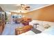 Spacious living room with a dining area, comfortable seating, and a ceiling fan at 1411 Water View W Dr, Largo, FL 33771