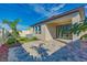 An outdoor living space with brick pavers and privacy fence surrounds the rear of the home at 14466 Pioneer Ridge Dr, Hudson, FL 34667