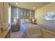 Well-lit bedroom featuring neutral walls, recessed lighting, and coastal-themed wall decor at 14466 Pioneer Ridge Dr, Hudson, FL 34667