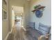 A hallway with a charming entryway bench adds character to this cozy home's interior design at 14466 Pioneer Ridge Dr, Hudson, FL 34667