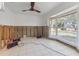A partially renovated room featuring tile flooring, a large window, and bare walls at 1859 Nevada Ne Ave, St Petersburg, FL 33703