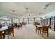 Well-lit community room featuring comfortable seating and lake views at 19029 Us Highway 19 N # 19C, Clearwater, FL 33764