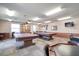 Spacious game room featuring two billiard tables, a television, and comfortable seating at 19029 Us Highway 19 N # 19C, Clearwater, FL 33764