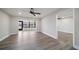 Bright living room with ceiling fan and doorway into another room at 19029 Us Highway 19 N # 19C, Clearwater, FL 33764