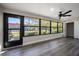 Open living room with large window and a black ceiling fan at 19029 Us Highway 19 N # 19C, Clearwater, FL 33764