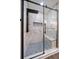This luxurious shower boasts marble walls, a built-in bench, rainfall showerhead, and mosaic tile flooring at 19029 Us Highway 19 N # 19C, Clearwater, FL 33764