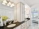 Bathroom features dual sinks, granite counters and access to Primary bedroom at 2 Adalia Ave # 602, Tampa, FL 33606