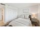 This bedroom features a soft rug, an accent wall, a comfortable bed, and ample closet space at 2 Adalia Ave # 602, Tampa, FL 33606