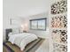 Bright bedroom with white walls, neutral decor, and a large window with plenty of natural light at 2 Adalia Ave # 602, Tampa, FL 33606