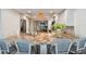 Bright kitchen features granite countertops, stainless steel appliances, and white cabinetry with seating at bar at 2 Adalia Ave # 602, Tampa, FL 33606